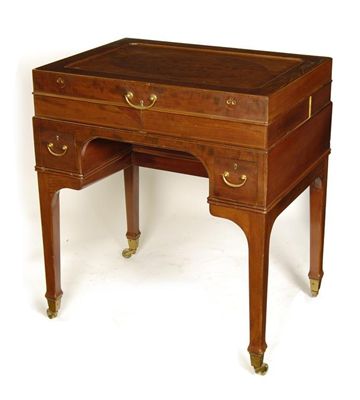 Appraisal: A mahogany lady's kneehole dressing table in the manner of