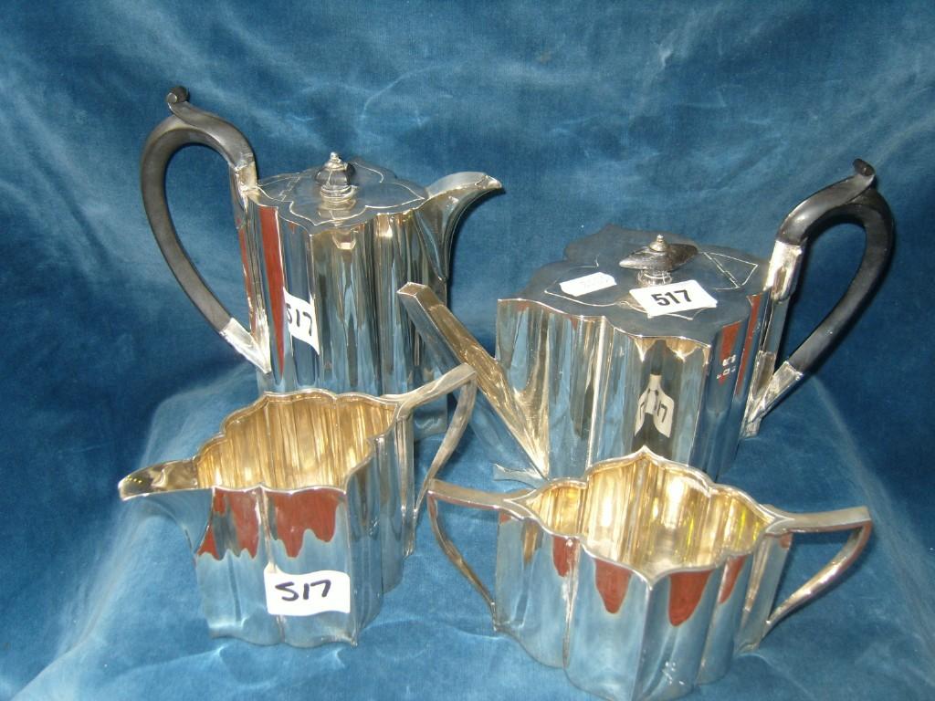 Appraisal: A stylised silver tea and coffee set of shaped form