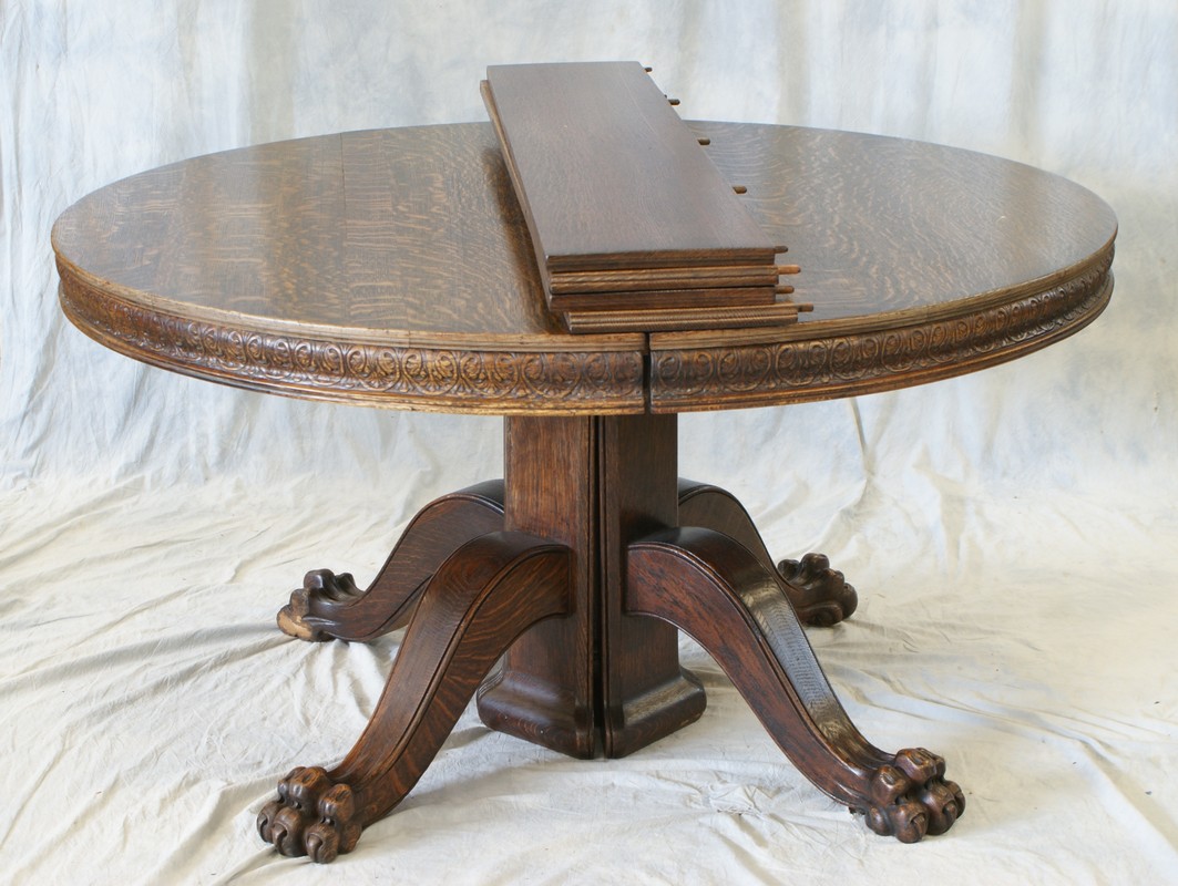 Appraisal: round tiger oak pedestal base dining room table claw feet