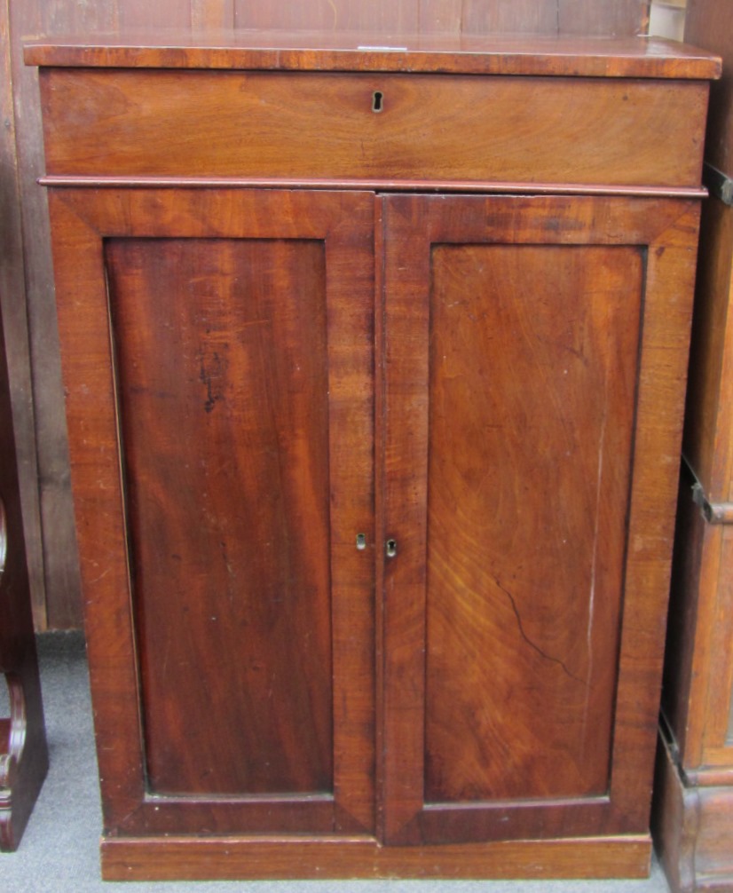 Appraisal: A th century mahogany side cabinet the single drawer over