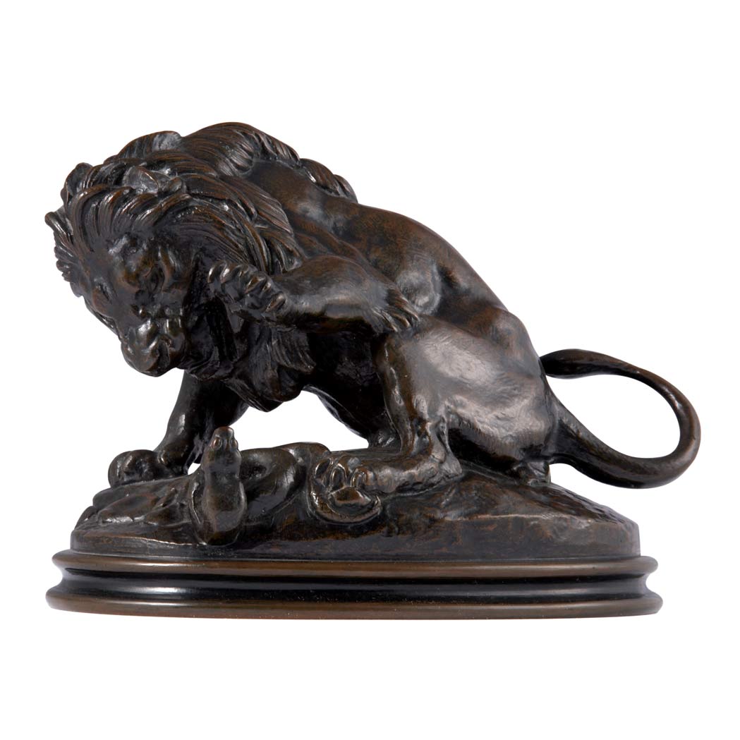 Appraisal: Bronze Group of a Lion Attacking a Serpent After a