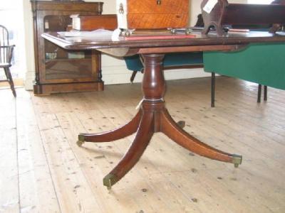 Appraisal: A GEORGE III MAHOGANY BREAKFAST TABLE of rounded oblong form