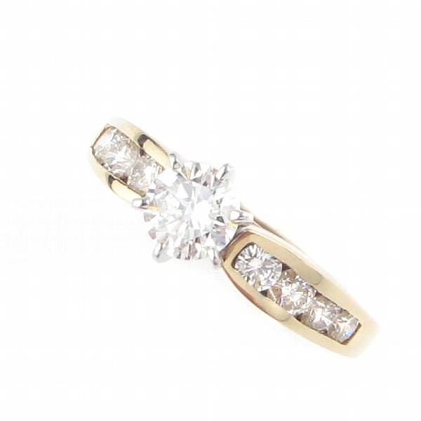 Appraisal: A diamond and fourteen karat gold solitaire ring centering one