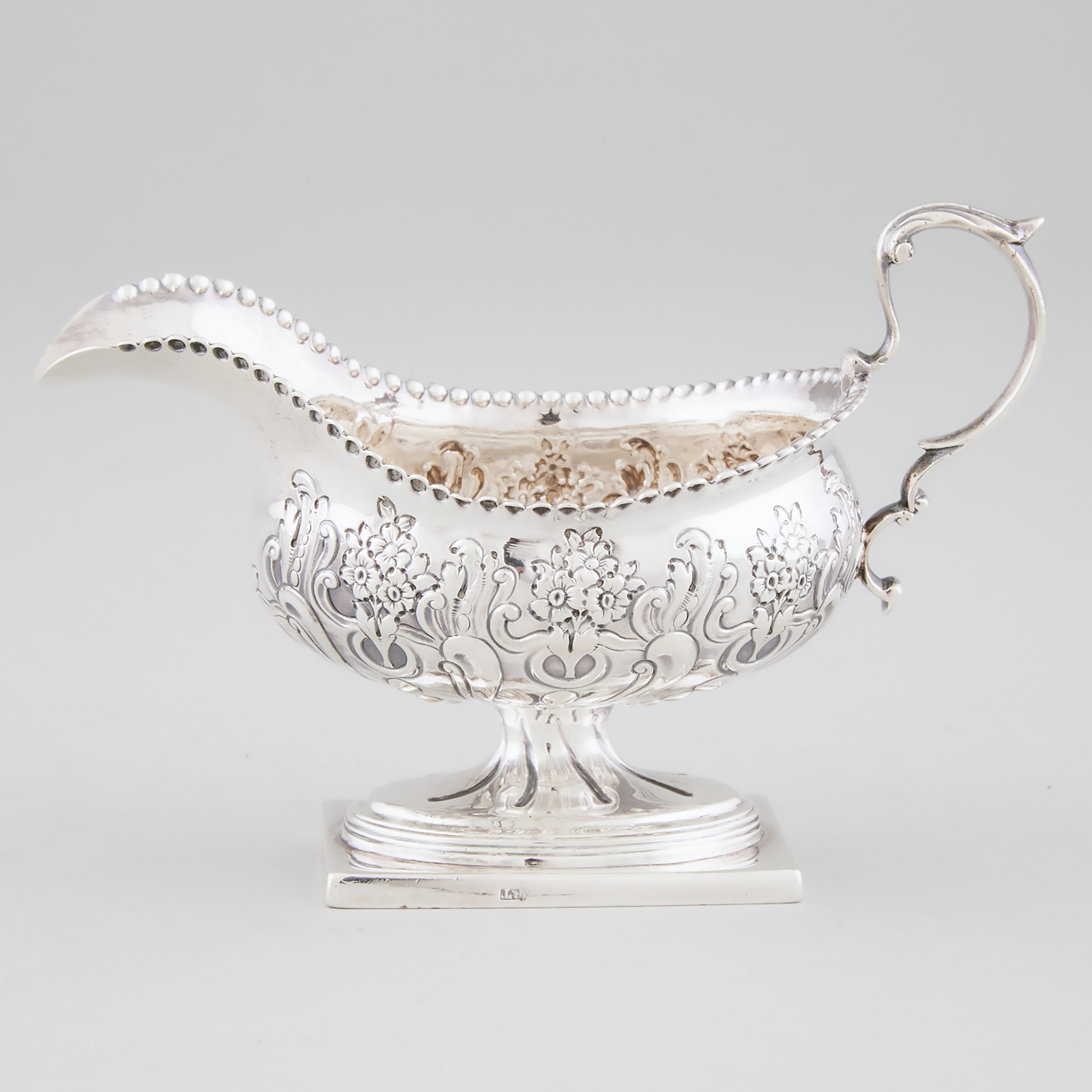 Appraisal: George III Silver Cream Boat Richard Turner London length in