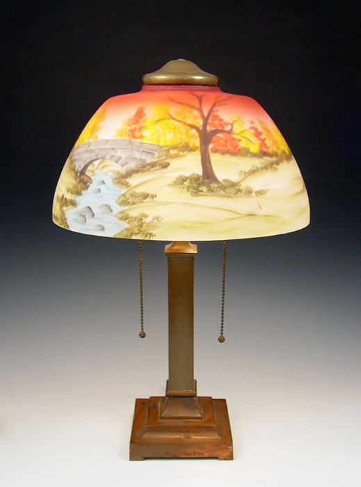 Appraisal: SIGNED MILLER REVERSE PAINTED DESK LAMP Scenic reverse painting is