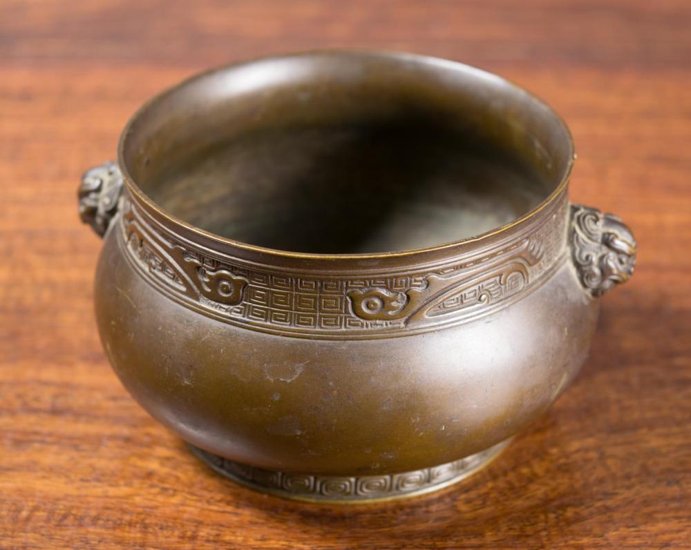 Appraisal: CHINESE PATINATED BRONZE CENSER of circular form and low profile