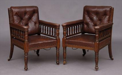 Appraisal: PAIR OF AESTHETIC MOVEMENT CARVED OAK ARMCHAIRS THE DESIGN ATTRIBUTED