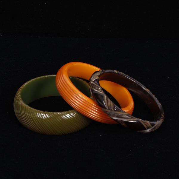 Appraisal: Three carved bakelite bangles width inner width