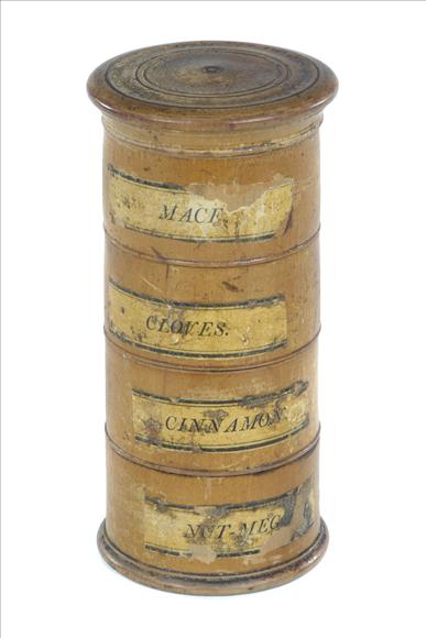 Appraisal: A mid- th century sycamore spice tower with labelled compartments