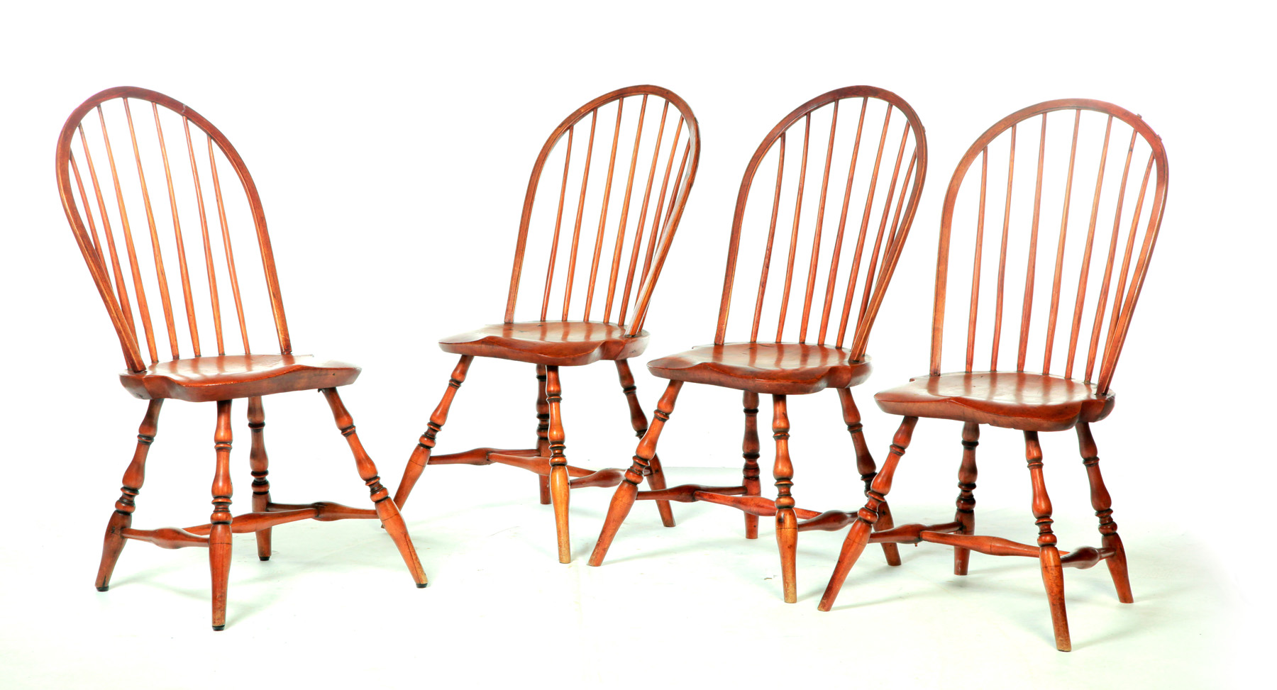 Appraisal: FOUR BOWBACK WINDSOR SIDE CHAIRS Nineteenth century mixed woods Refinished