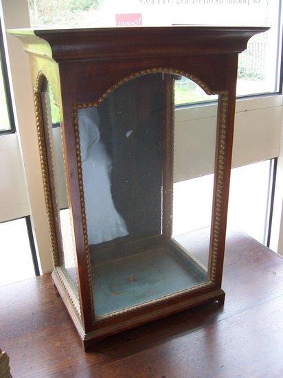 Appraisal: A Spanish mahogany shrine with gilded border on bracket feet