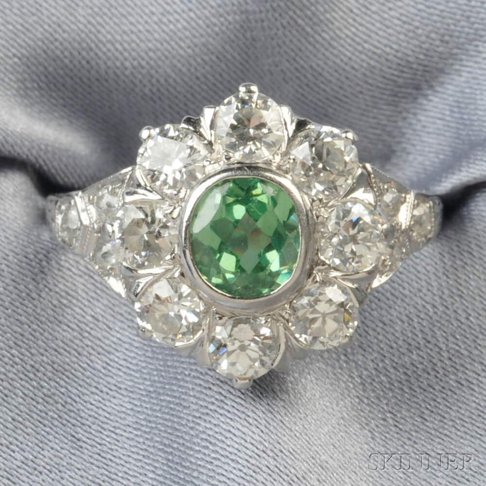 Appraisal: Platinum Demantoid Garnet and Diamond Ring bezel-set with an oval-cut