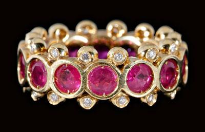 Appraisal: Ruby diamond eternity ring round faceted rubies total estimated weight