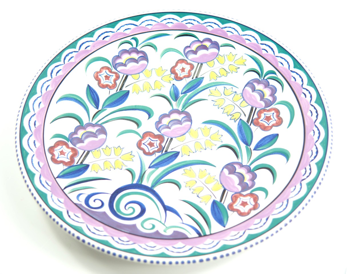 Appraisal: A Poole Pottery charger traditionally painted with flowers by Susan