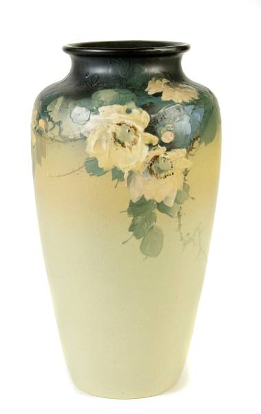 Appraisal: A Weller glazed earthenware cylindrical vase impressed WELLER height in