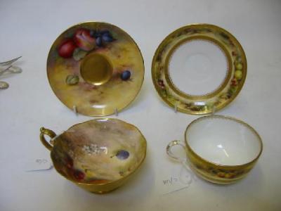 Appraisal: A ROYAL WORCESTER SHALLOW TEACUP AND SAUCER dated and painted