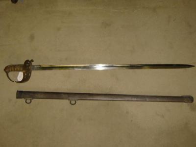 Appraisal: A SARGEANT'S ARTILLERY SWORD the reeded brass basket hilt with