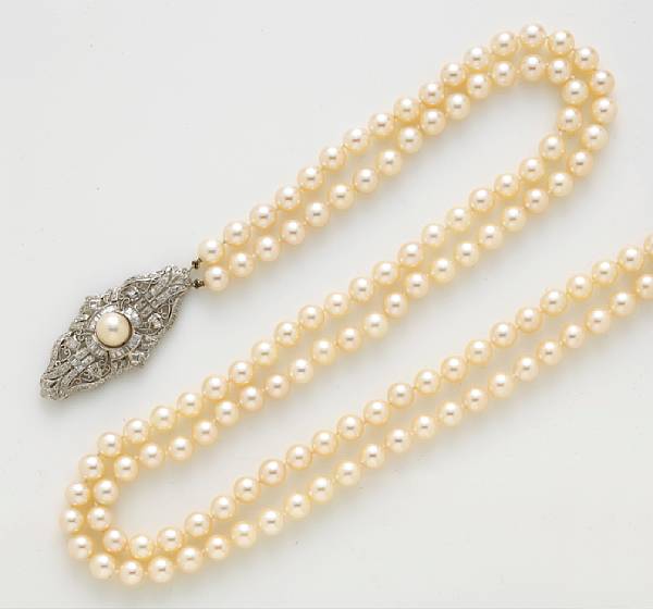 Appraisal: A cultured pearl double strand necklace with diamond clasp cultured