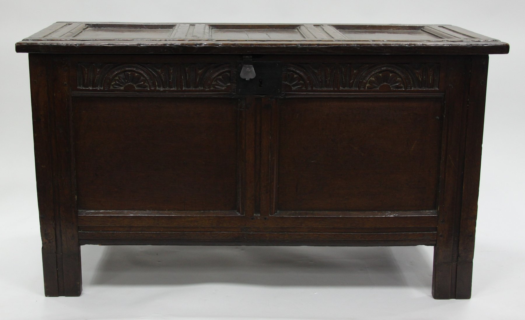 Appraisal: An early th Century oak chest with triple panel hinged