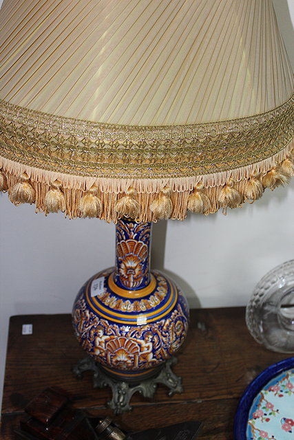 Appraisal: A YELLOW AND BLUE GLAZED BOTTLE VASE decorated with cherubs