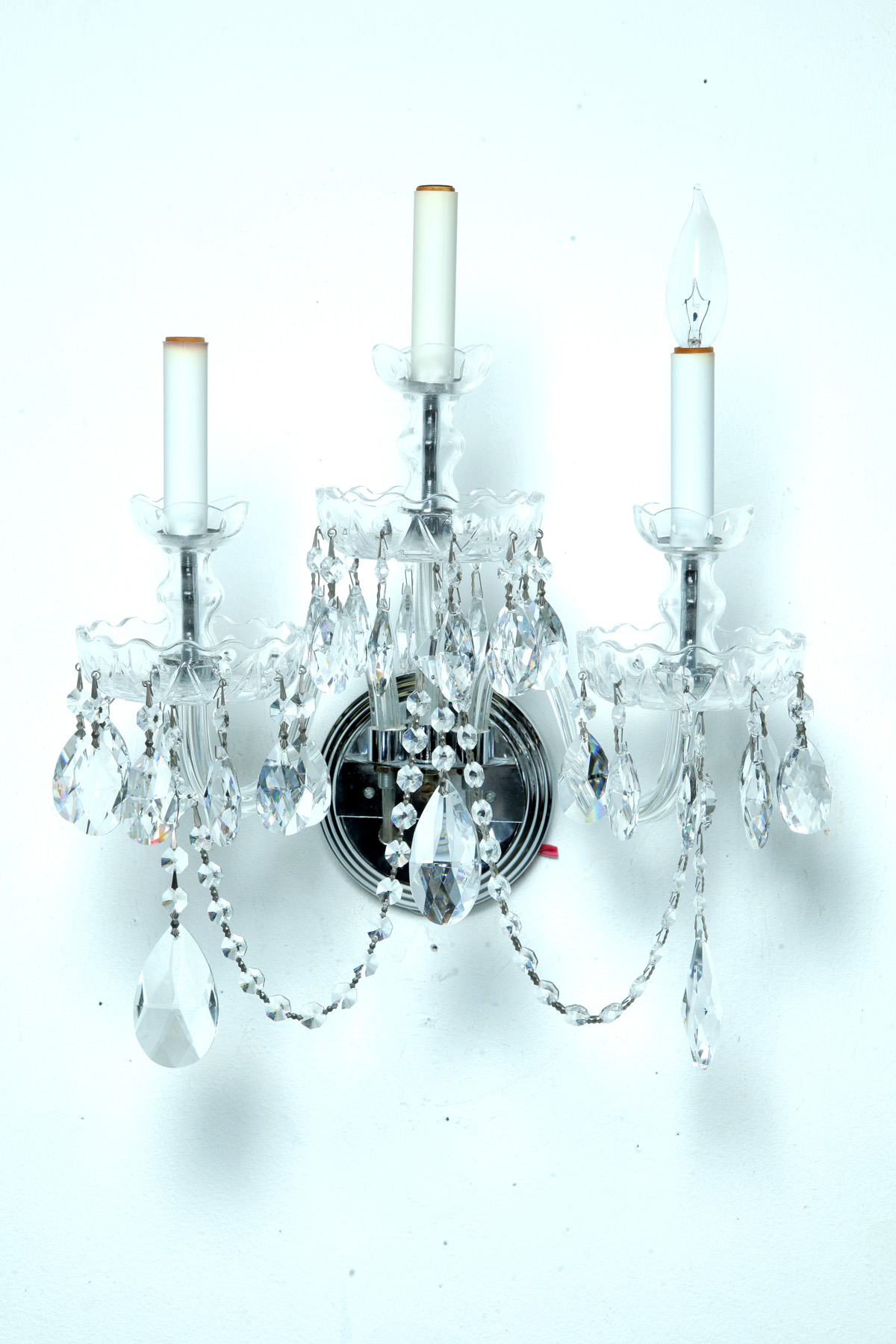 Appraisal: FOUR CRYSTAL SCONCES Twentieth century Three-arm sconces with chrome back