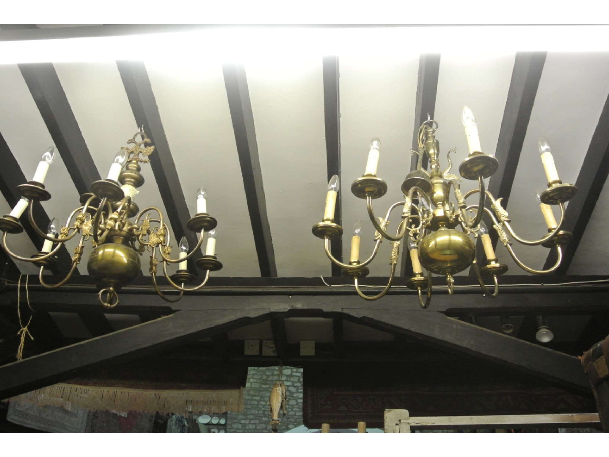 Appraisal: A Dutch style hollow cast anodised brass eight branch electrolier