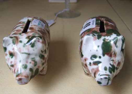 Appraisal: A pair of Scottish pottery piggy banks early th century