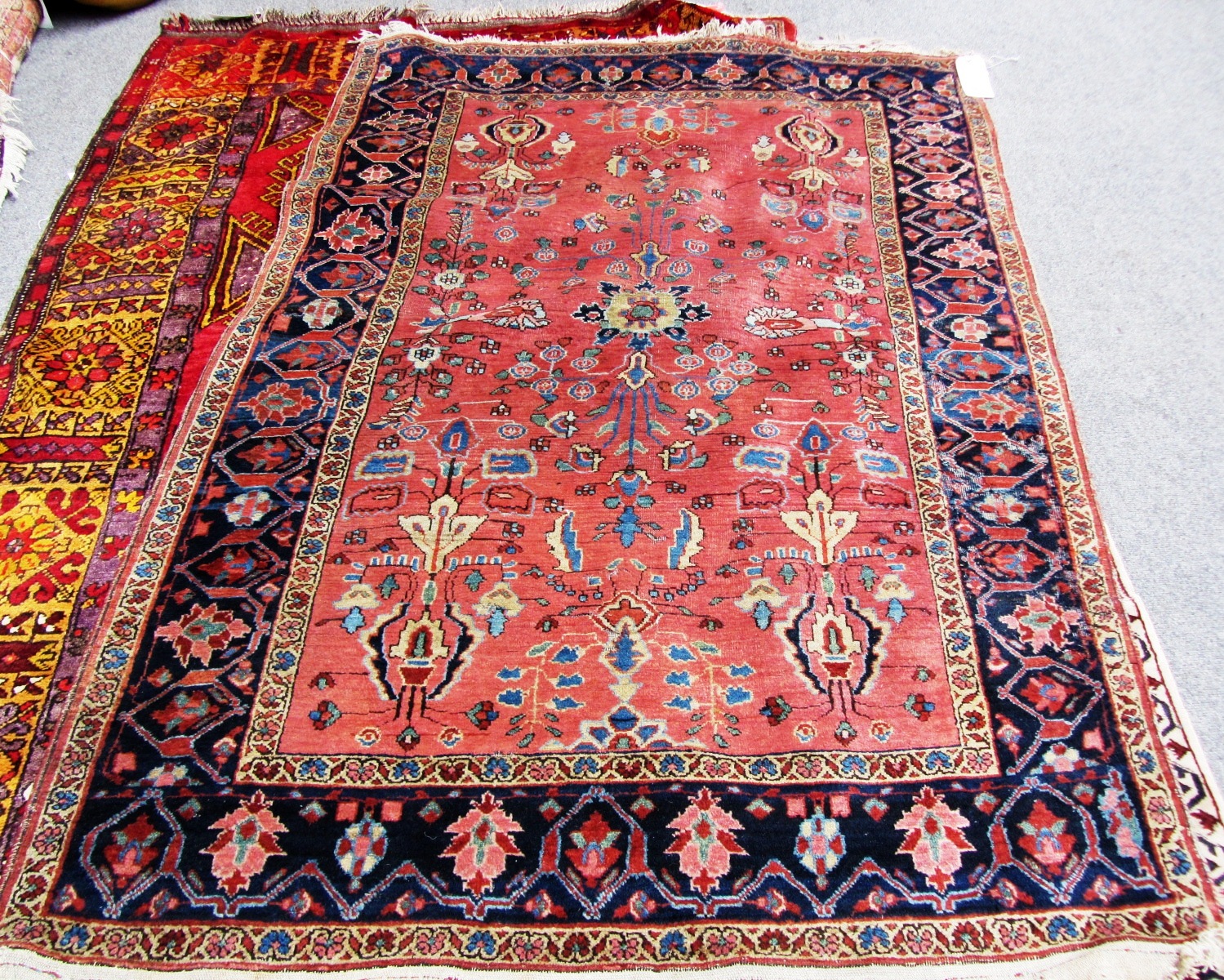 Appraisal: A Sarouk rug Persian the pink field with central rosette