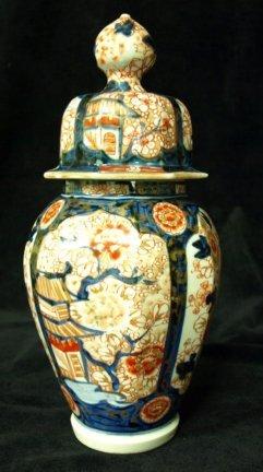 Appraisal: An Imari vase and cover of octagonal baluster form the