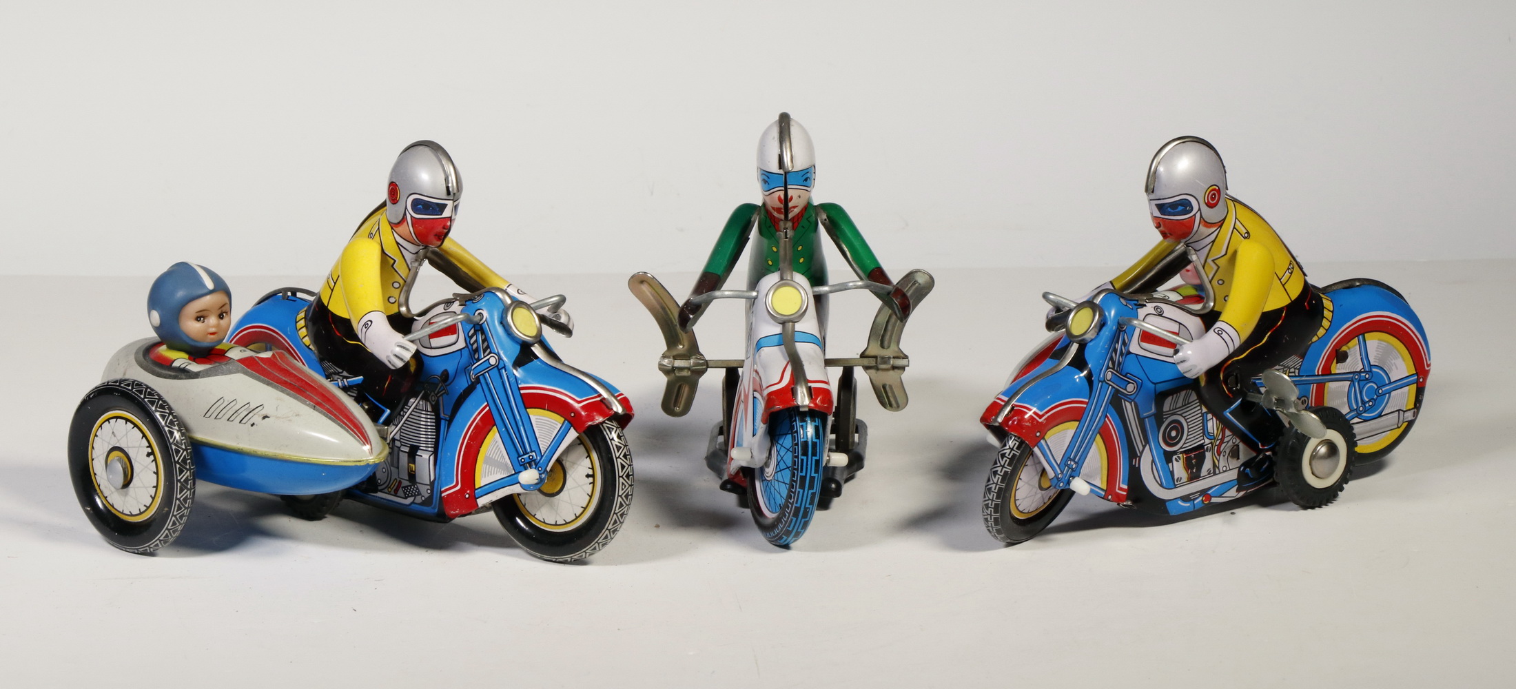 Appraisal: CONTEMPORARY REPLICA TIN LITHO S MOTORCYCLE TOYS Wind-ups two with