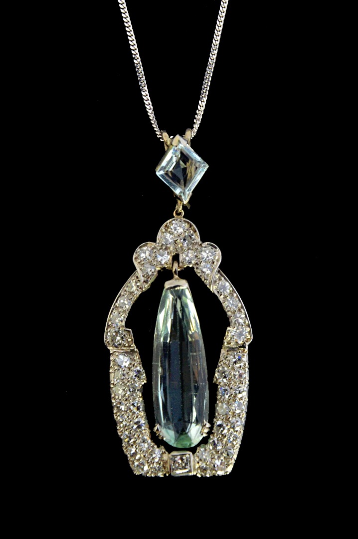 Appraisal: A diamond and aquamarine pendant of panel shaped openwork form