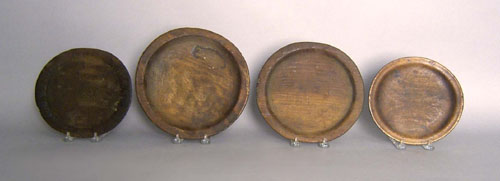 Appraisal: Four wooden plates th c largest - dia