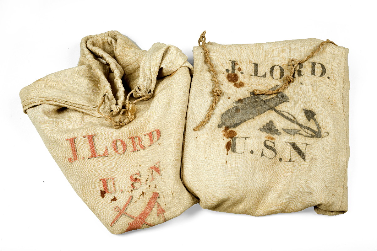 Appraisal: TWO STENCILED LINEN SEABAGS BELONGING TO JOHN LORD U S