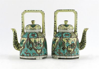 Appraisal: A pair of Samson famille jaune ewers and covers the