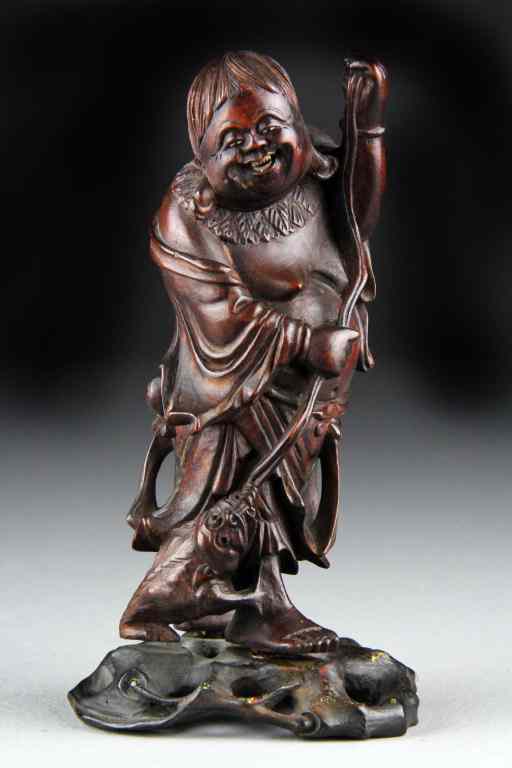 Appraisal: Chinese Carved Boxwood FigureFinely carved to depict Liuhai and his