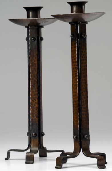 Appraisal: ROYCROFT Pair of hammered copper tall strap candlesticks Orb and