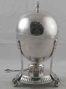 Appraisal: A late Victorian balloon shaped silver four egg coddler on