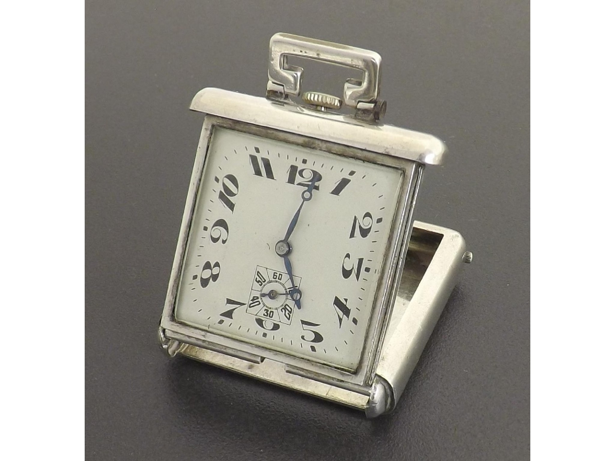 Appraisal: Swiss silver travel watch square silvered dial with stylised Arabic