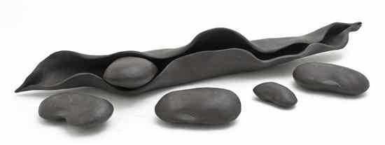 Appraisal: A Black Porcelain Peapod Form Sculpture comprising a pod and