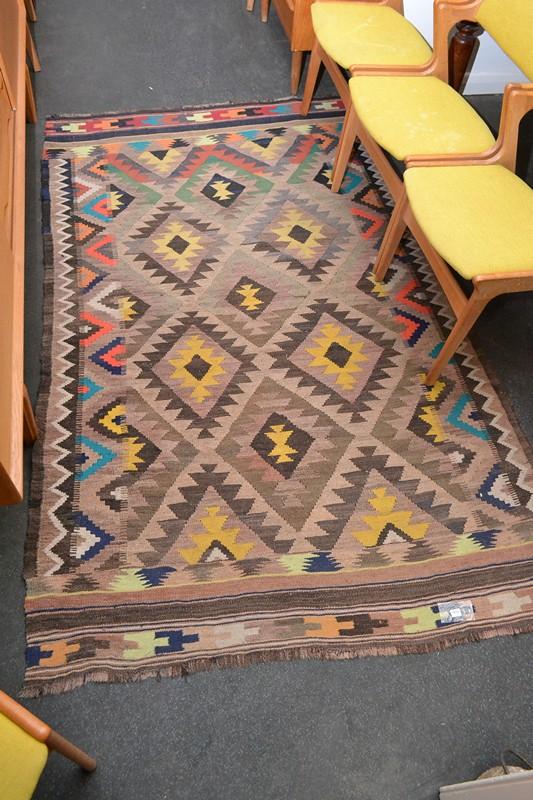 Appraisal: A TURKISH KILIM RUG IN POLYCHROME TONES A TURKISH KILIM