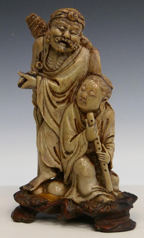 Appraisal: FINELY CARVED CHINESE SOAPSTONE LOHAN GROUP A finely carved Chinese