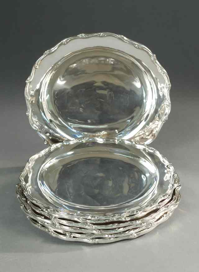 Appraisal: SET OF EIGHT MEXICO STERLING SILVER PLATES with raised scalloped