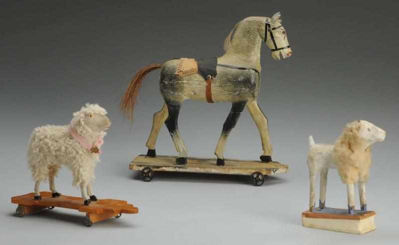 Appraisal: Lot of Antique Toys Wooden horse on a wheeled platform