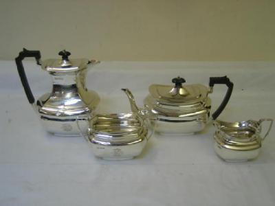 Appraisal: AN EDWARDIAN TEA AND COFFEE SET of dished oblong form