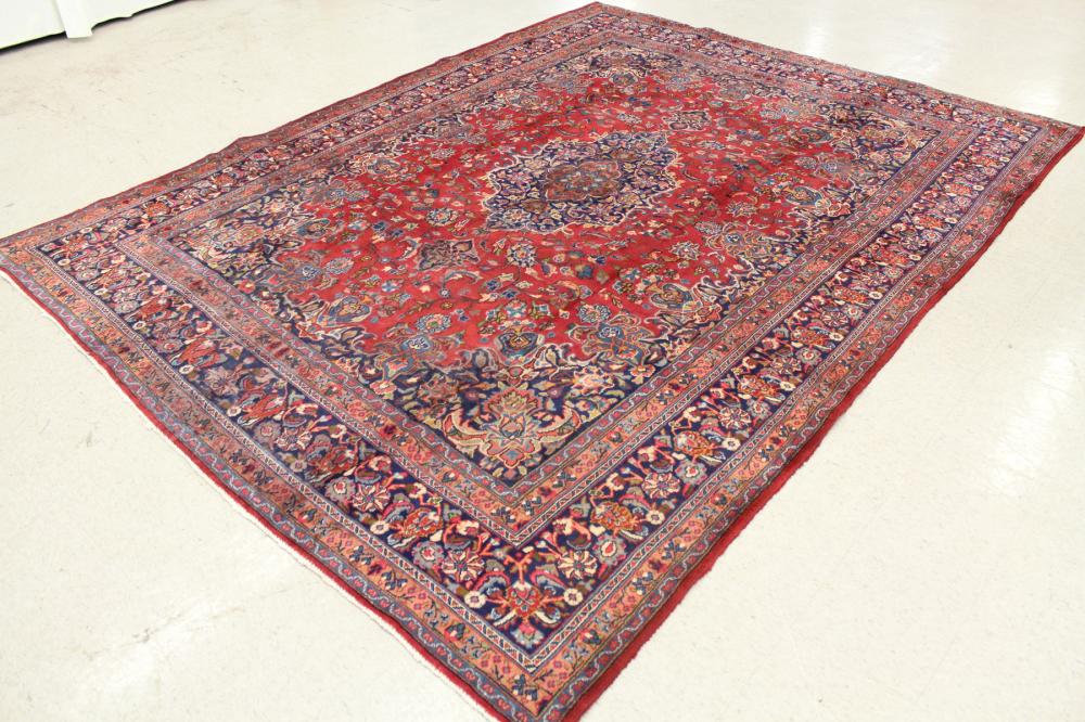 Appraisal: HAND KNOTTED PERSIAN CARPET floral and central floral medallion design