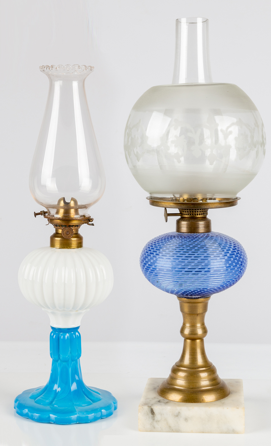 Appraisal: TH CENTURY OIL LAMPS Opaque White and Blue Melon Oil