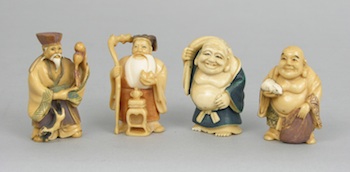 Appraisal: A Set of Four Netsuke Carvings Containing a standing bearded