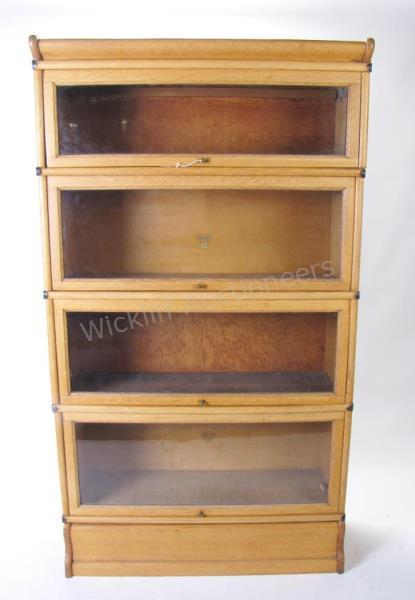 Appraisal: A Macey model four-section barrister's bookcase with separate top section