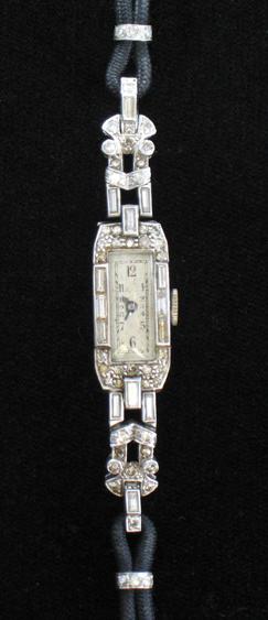 Appraisal: AN EDWARDIAN LADY'S DIAMOND COCKTAIL WATCH the dial surrounded with