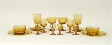 Appraisal: Amber Glass Table Service Comprising nine wine glasses eleven champagne